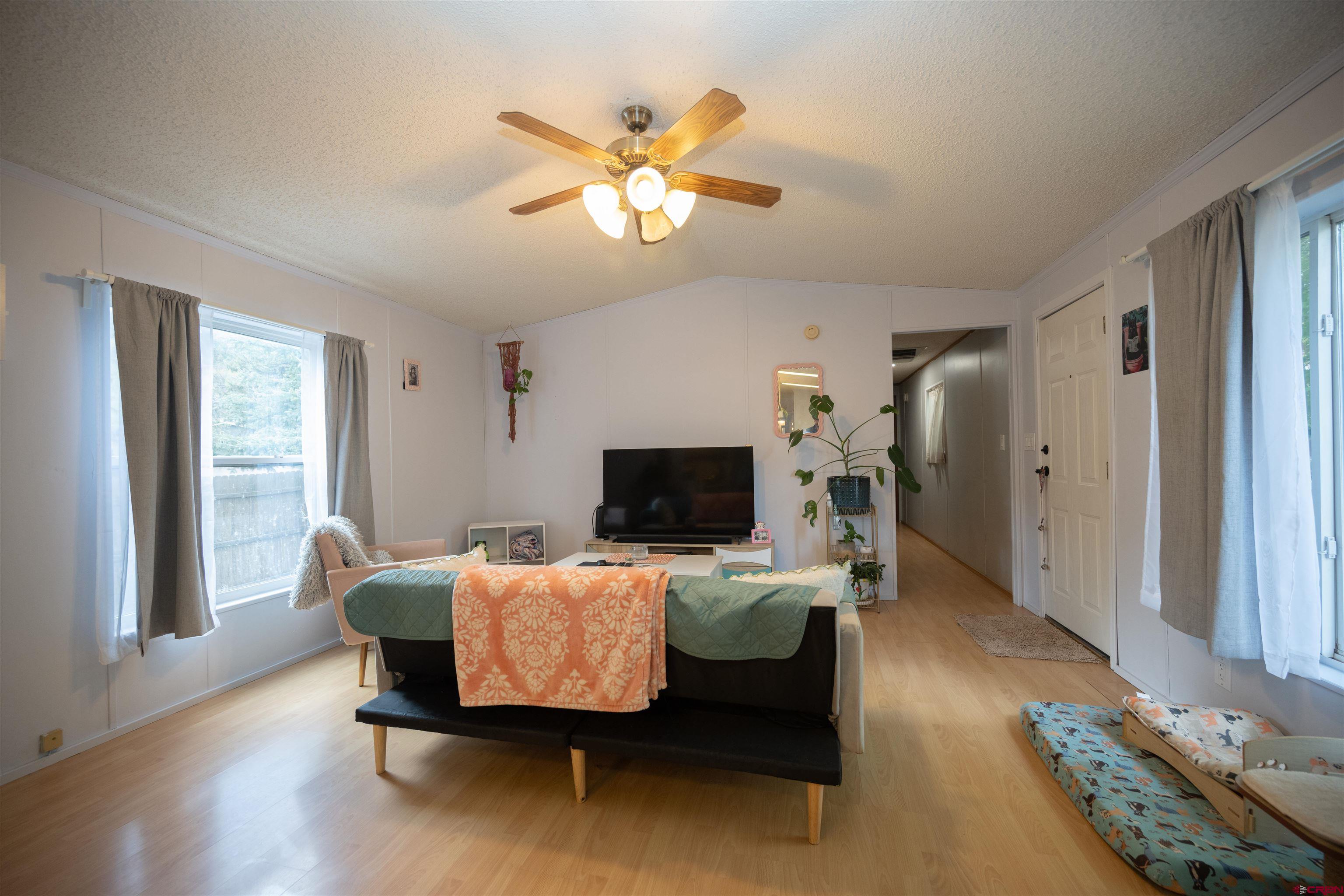 2 Mulberry Way Durango, CO 81301 - Photo 16 of 40 a living room with furniture and wooden floor