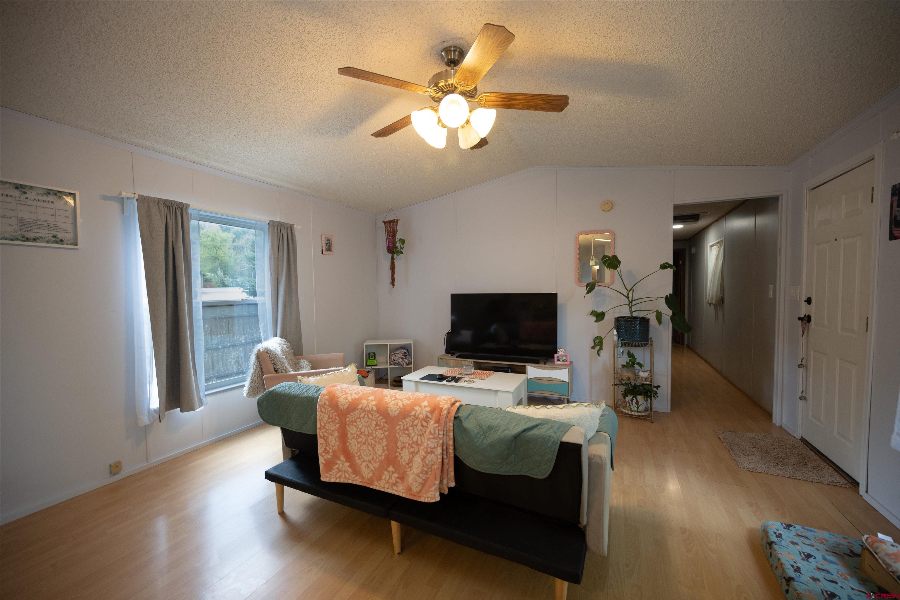 2 Mulberry Way Durango, CO 81301 - Photo 17 of 40 a living room with furniture and a flat screen tv