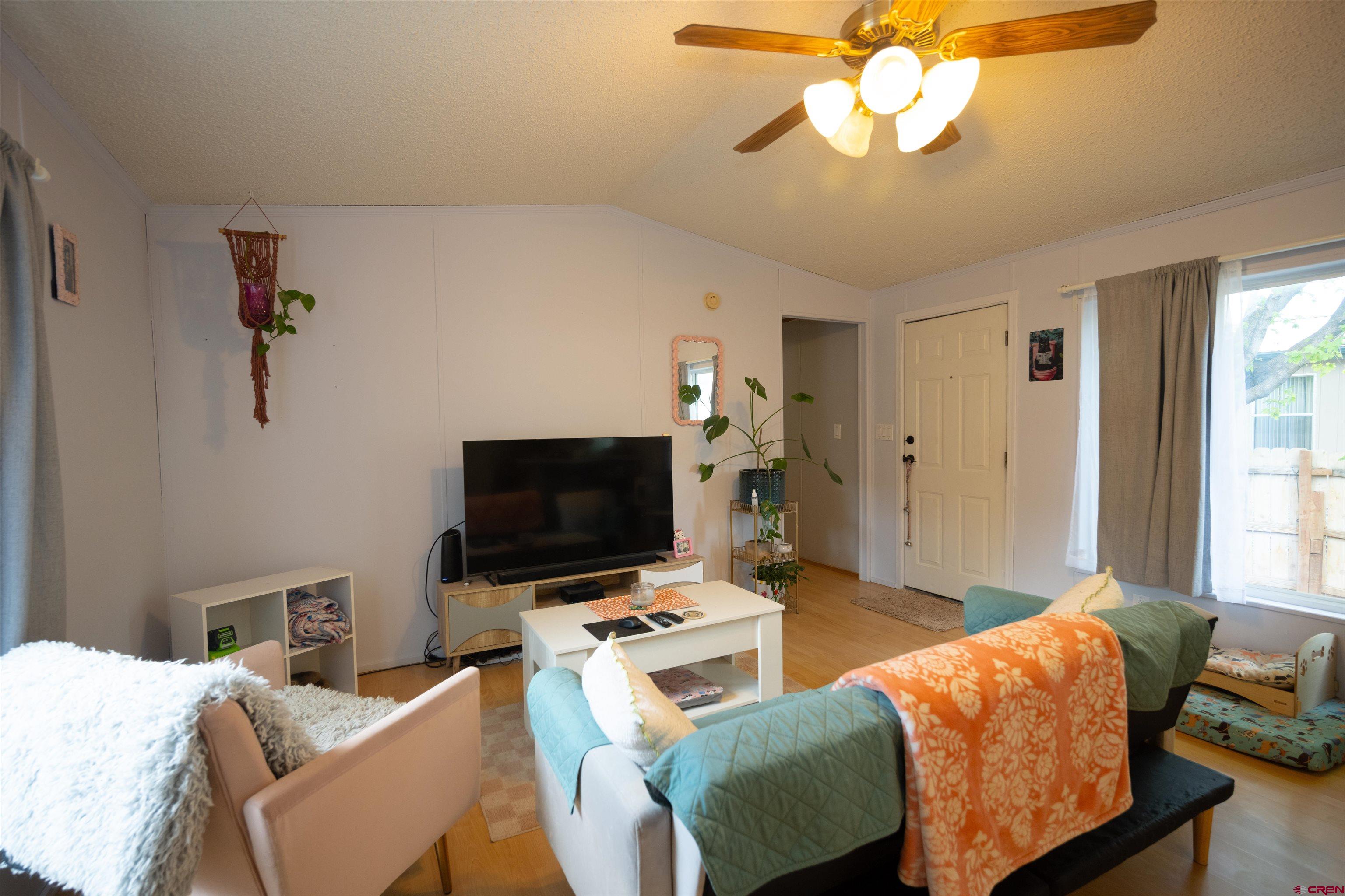2 Mulberry Way Durango, CO 81301 - Photo 18 of 40 a living room with furniture and a flat screen tv