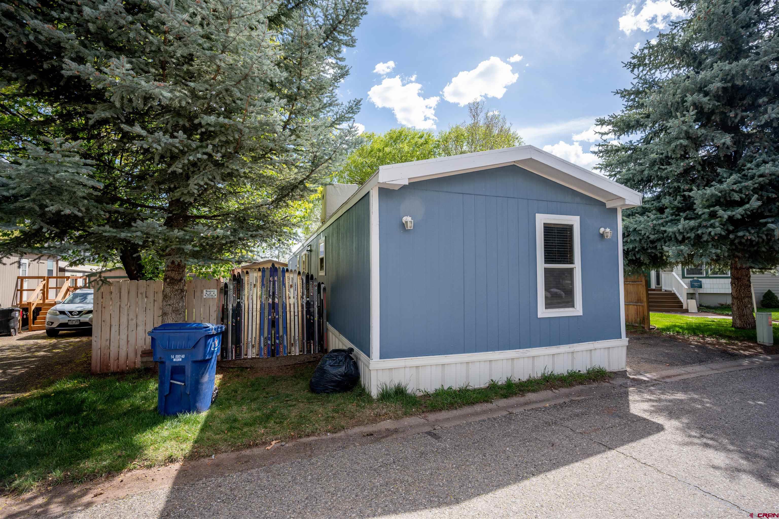 2 Mulberry Way Durango, CO 81301 - Photo 2 of 40 a front view of a house with garden