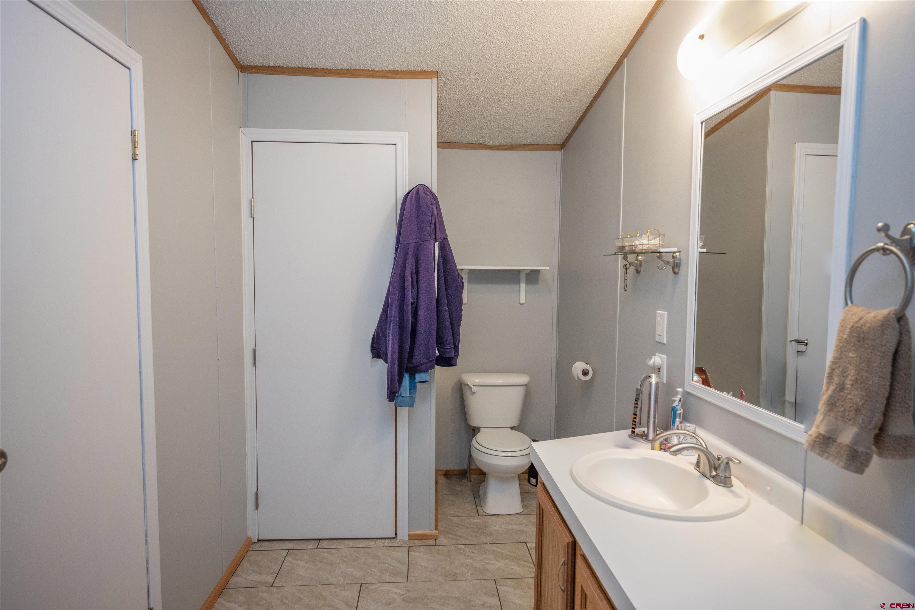 2 Mulberry Way Durango, CO 81301 - Photo 22 of 40 a bathroom with a sink and a mirror