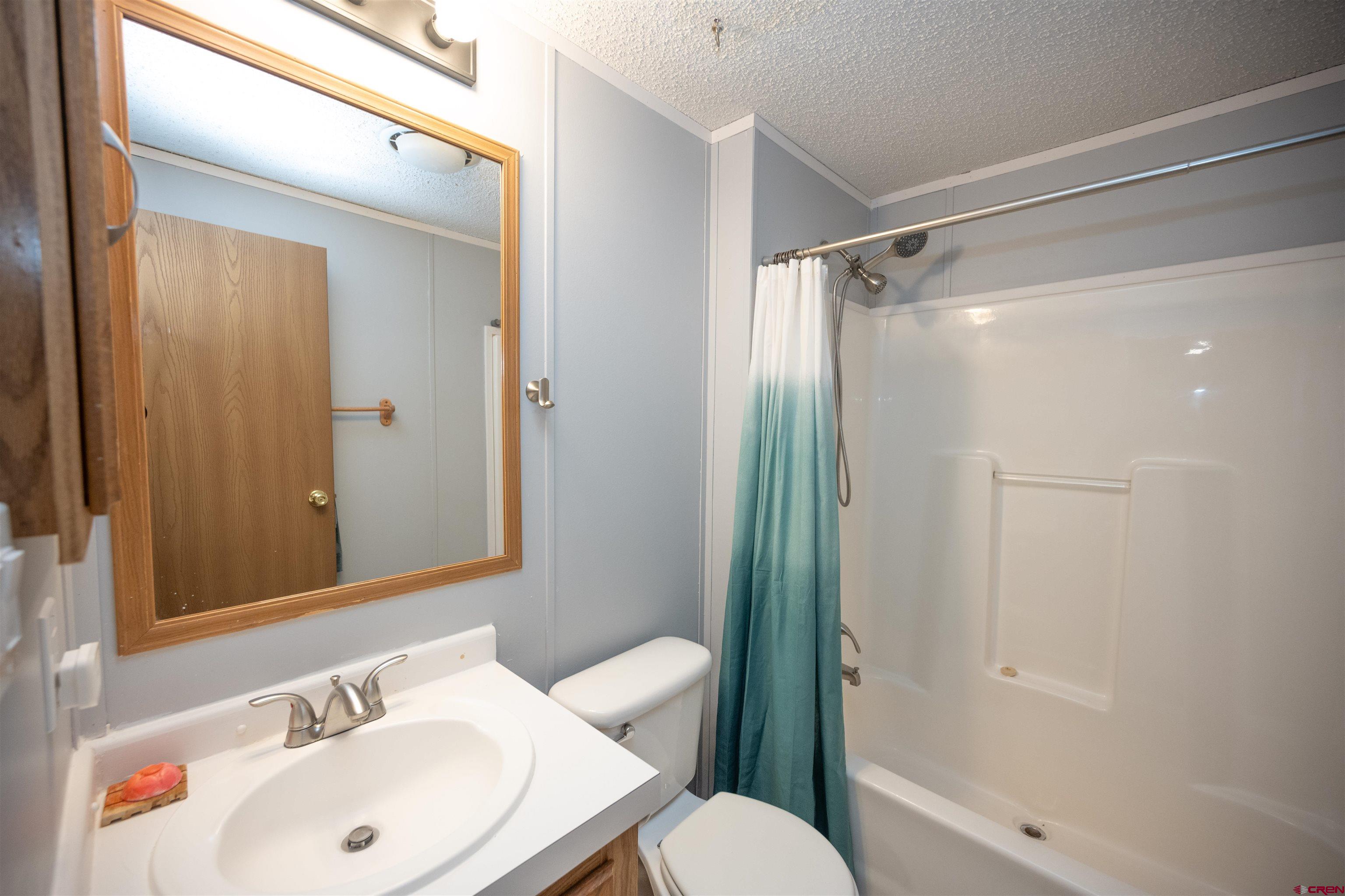2 Mulberry Way Durango, CO 81301 - Photo 29 of 40 a bathroom with a sink toilet and shower
