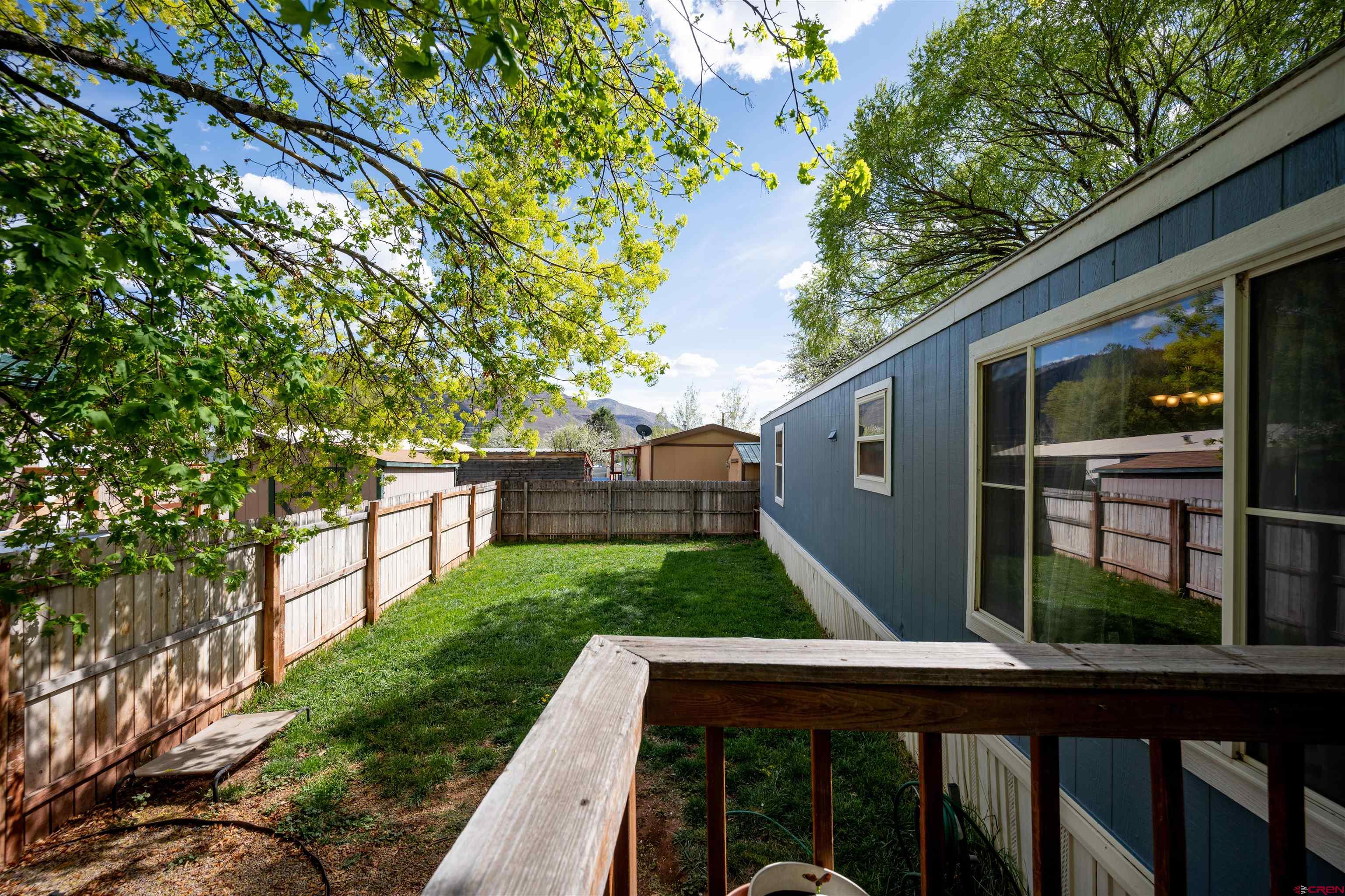 2 Mulberry Way Durango, CO 81301 - Photo 38 of 40 a backyard of a house with lots of green space