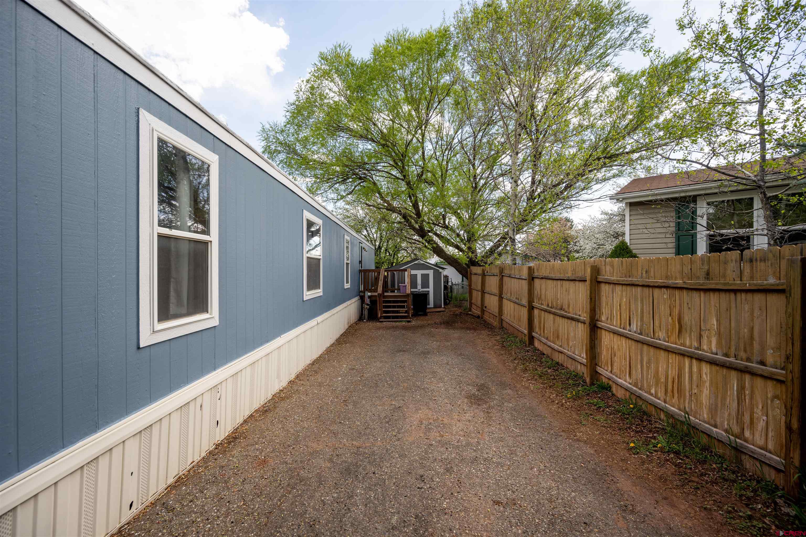 2 Mulberry Way Durango, CO 81301 - Photo 5 of 40 a view of a house with a wooden fence