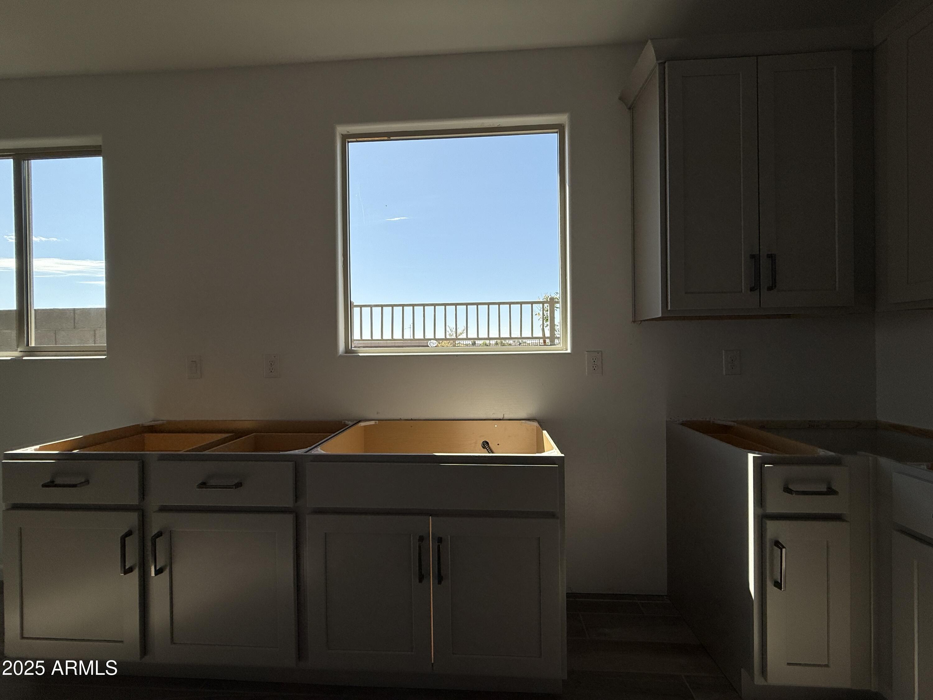 9627 West Tamarisk Avenue Tolleson, AZ 85353 - Photo 13 of 42 a car parked in front of a window