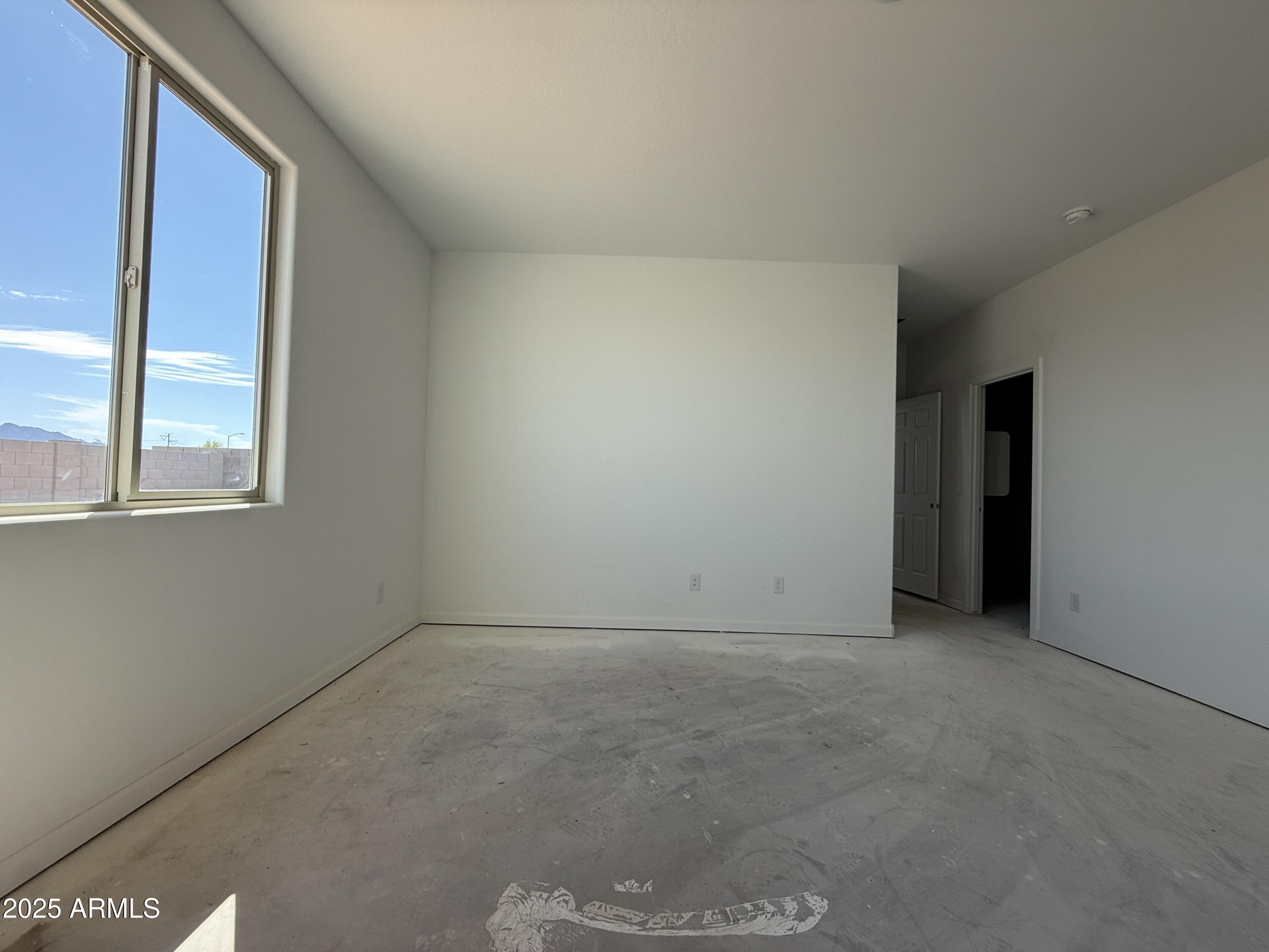 9627 West Tamarisk Avenue Tolleson, AZ 85353 - Photo 27 of 42 a view of an empty room with a window