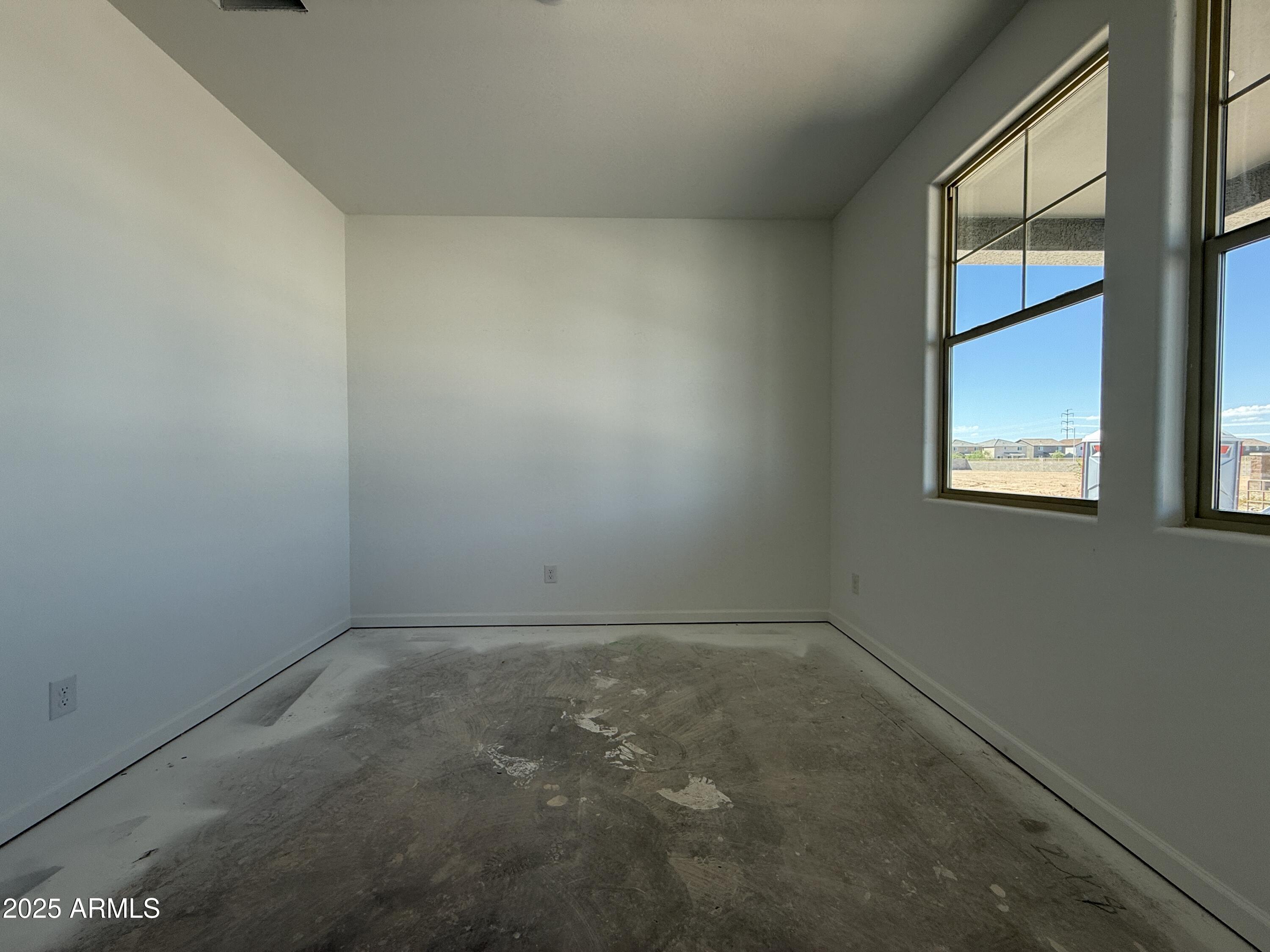 9627 West Tamarisk Avenue Tolleson, AZ 85353 - Photo 5 of 42 an empty room with a window