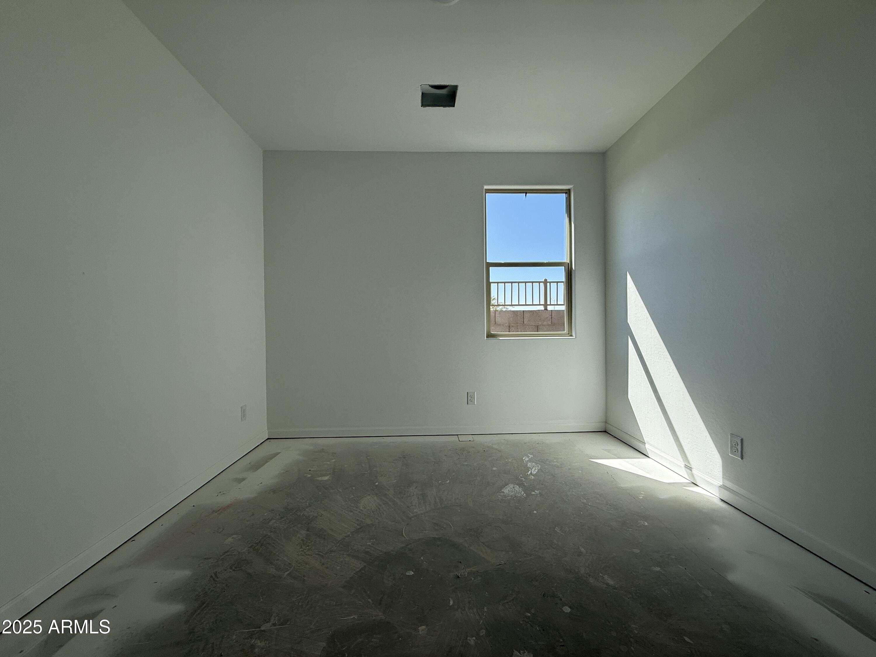 9627 West Tamarisk Avenue Tolleson, AZ 85353 - Photo 8 of 42 an empty room with windows