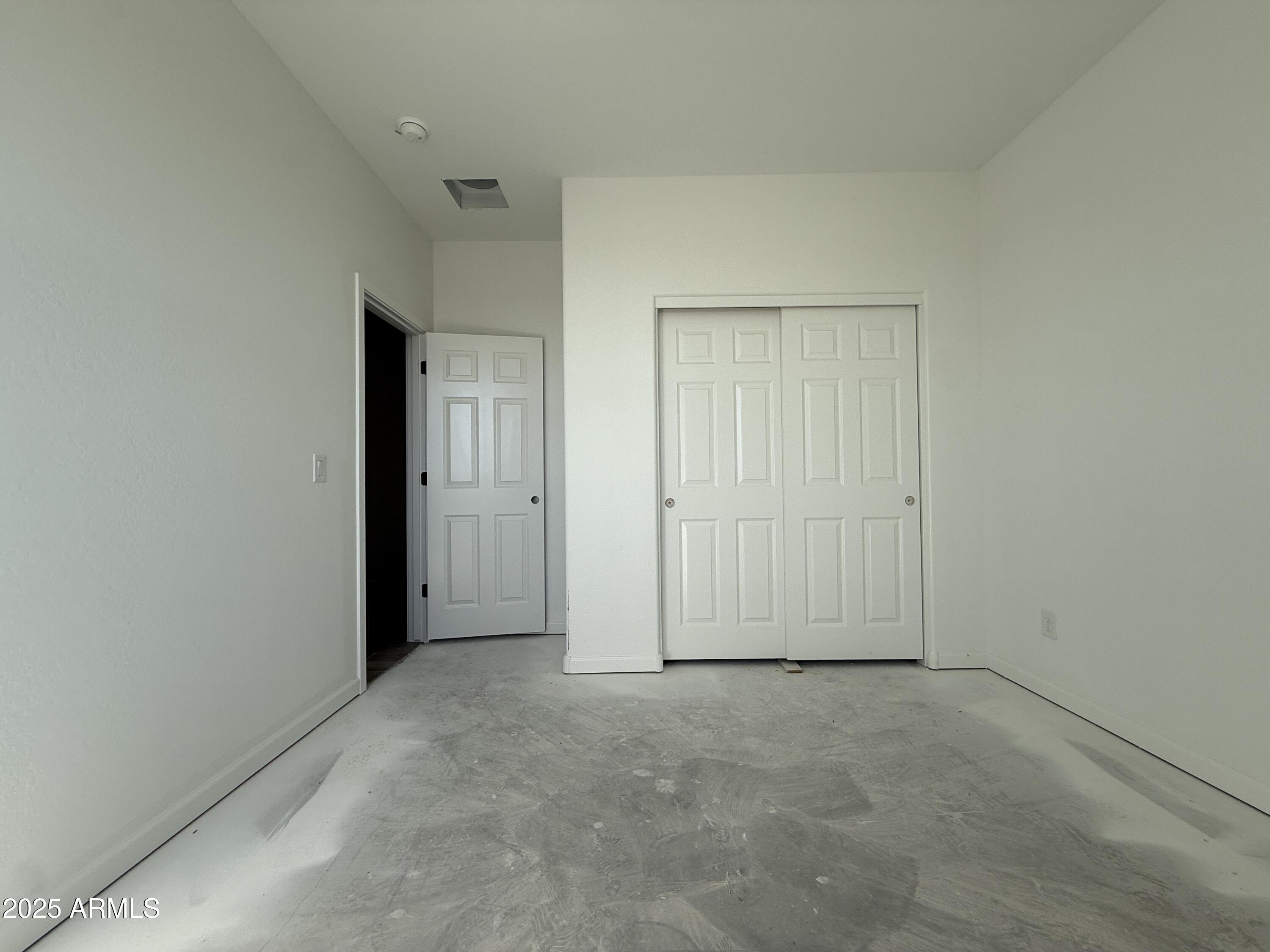 9627 West Tamarisk Avenue Tolleson, AZ 85353 - Photo 9 of 42 an empty room with closet area