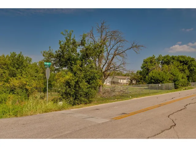 a view of a yard with an outdoor space