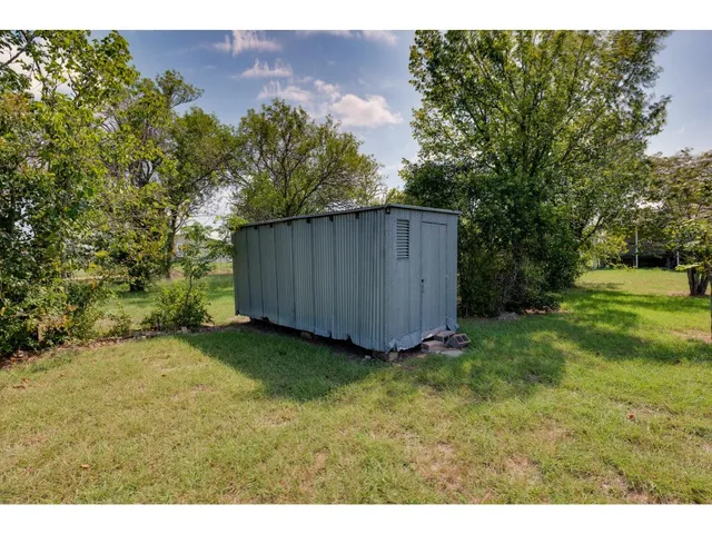 a view of backyard with green space