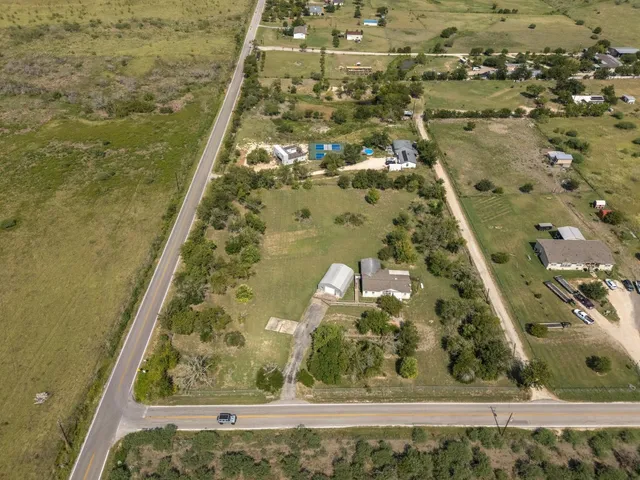 a bathroom with a granite countertop shower and a garden