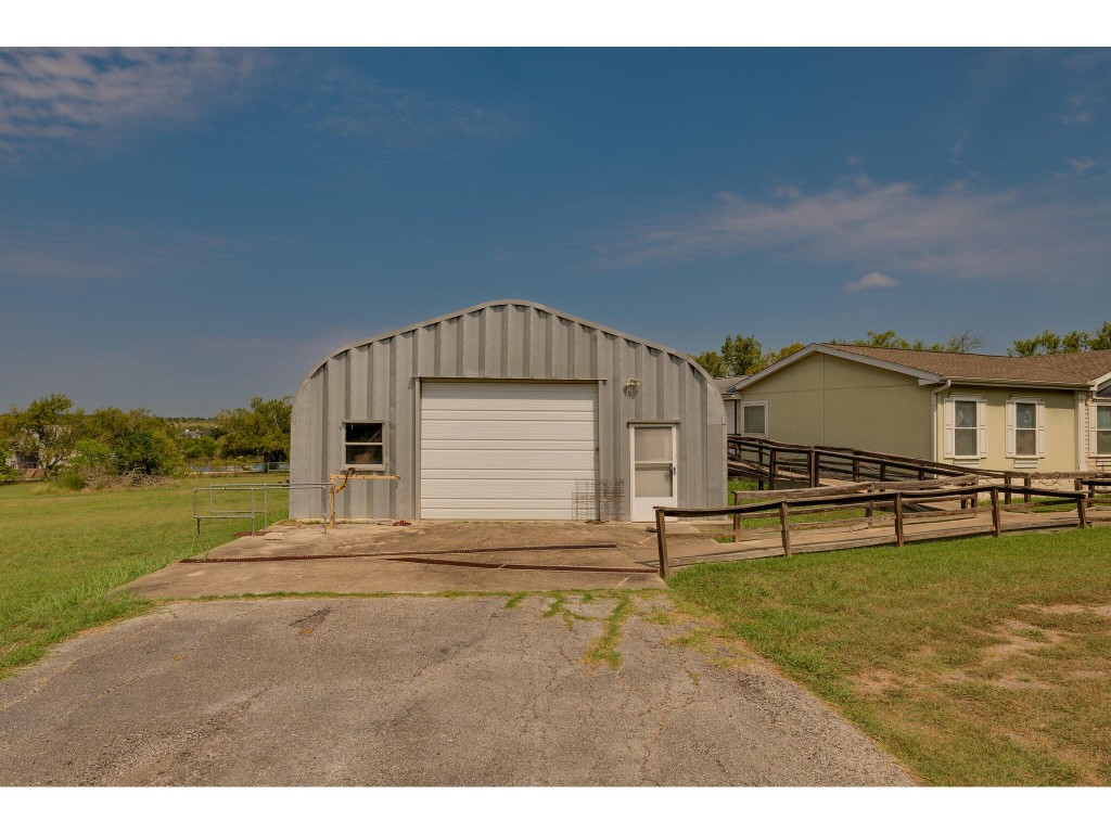 13506 Palmer Road Buda, TX 78610 - Photo 33 of 33 a view of a house with a yard