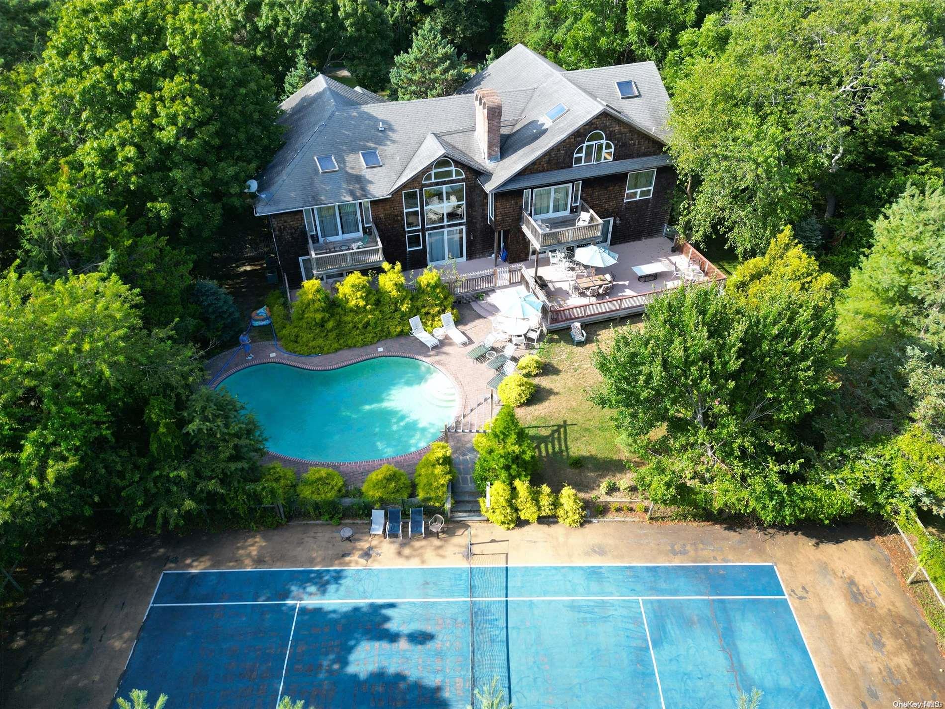 28 Club Lane Remsenburg, NY 11960 - Photo 1 of 33 an aerial view of a house with yard swimming pool and outdoor seating