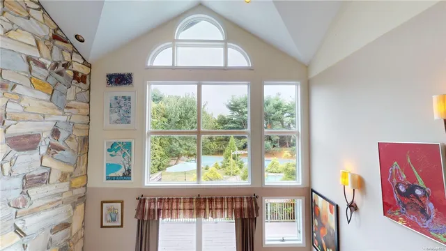 a view of a livingroom with furniture and windows