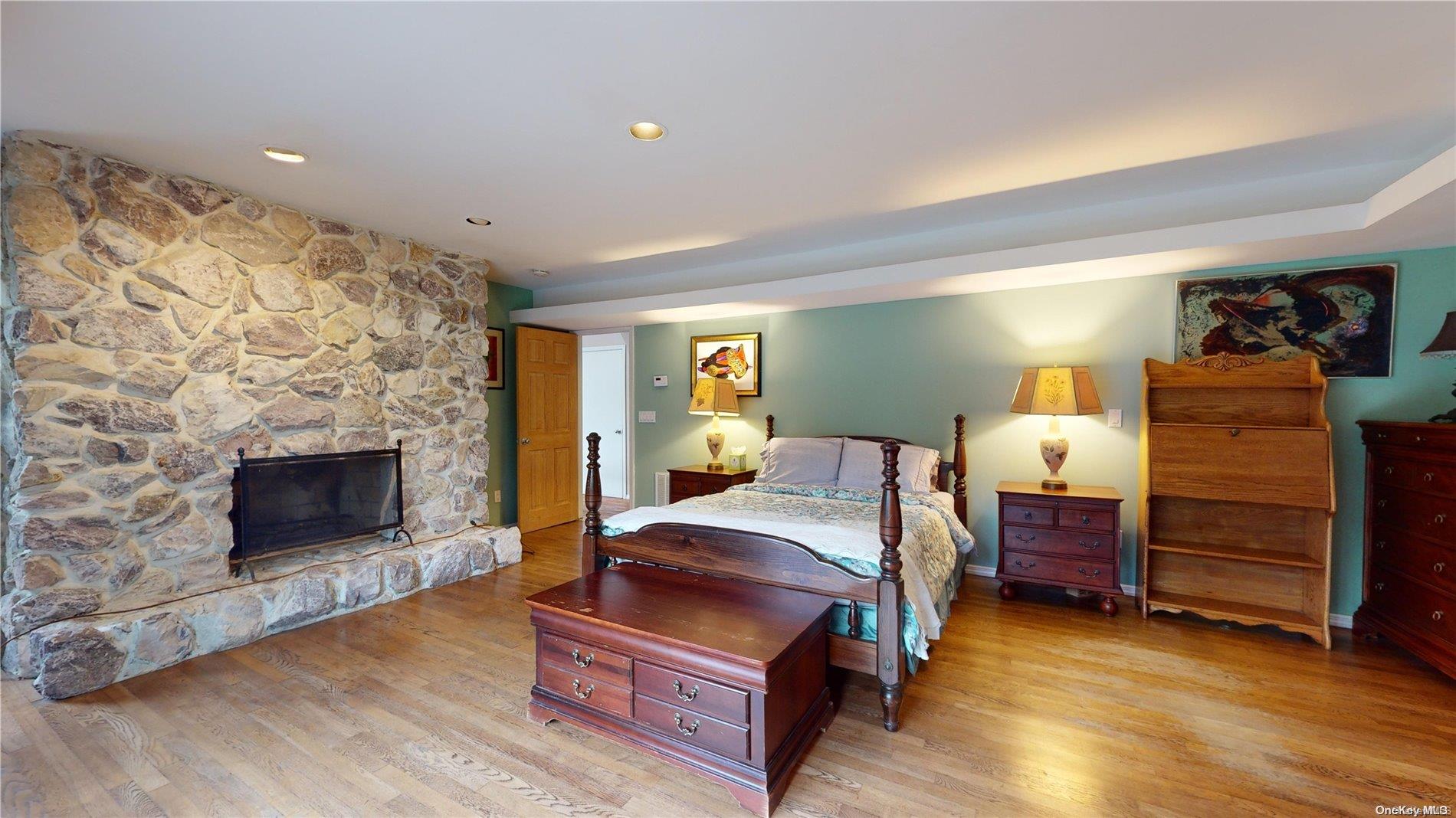 28 Club Lane Remsenburg, NY 11960 - Photo 24 of 33 a bed room with a bed and a television