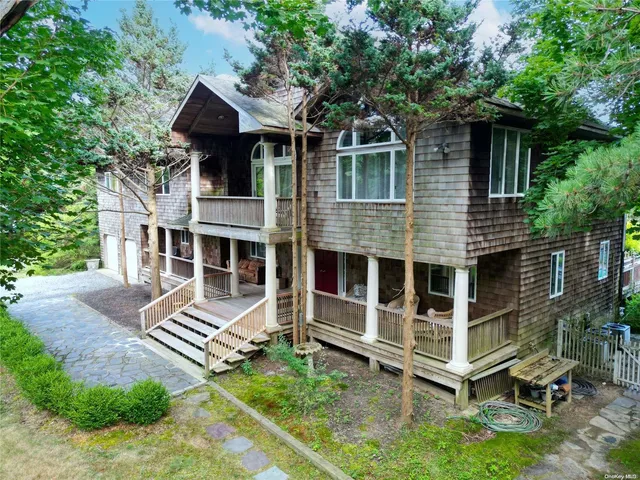 a view of a house with a yard and deck