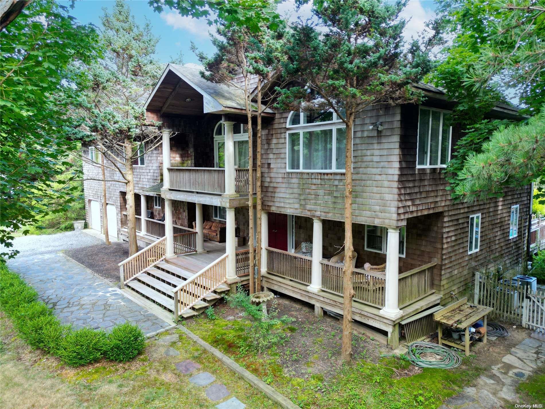 28 Club Lane Remsenburg, NY 11960 - Photo 3 of 33 a view of a house with a yard and deck