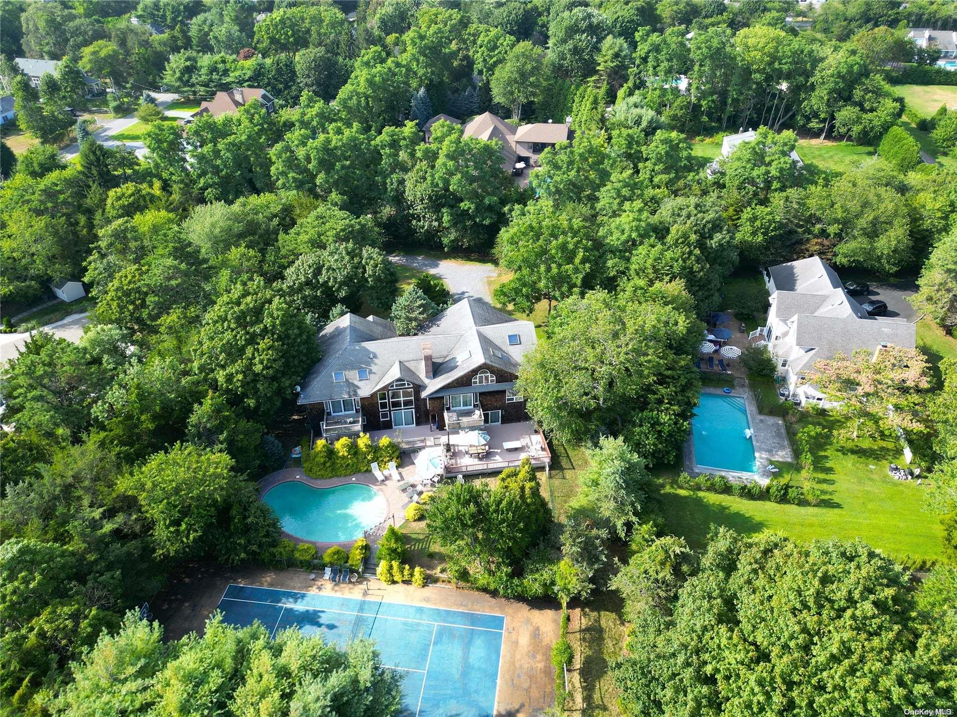 28 Club Lane Remsenburg, NY 11960 - Photo 31 of 33 an aerial view of a house with a yard and lake view