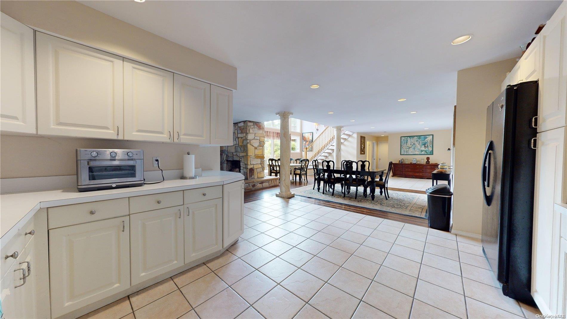 28 Club Lane Remsenburg, NY 11960 - Photo 8 of 33 a kitchen with stainless steel appliances a refrigerator and a sink