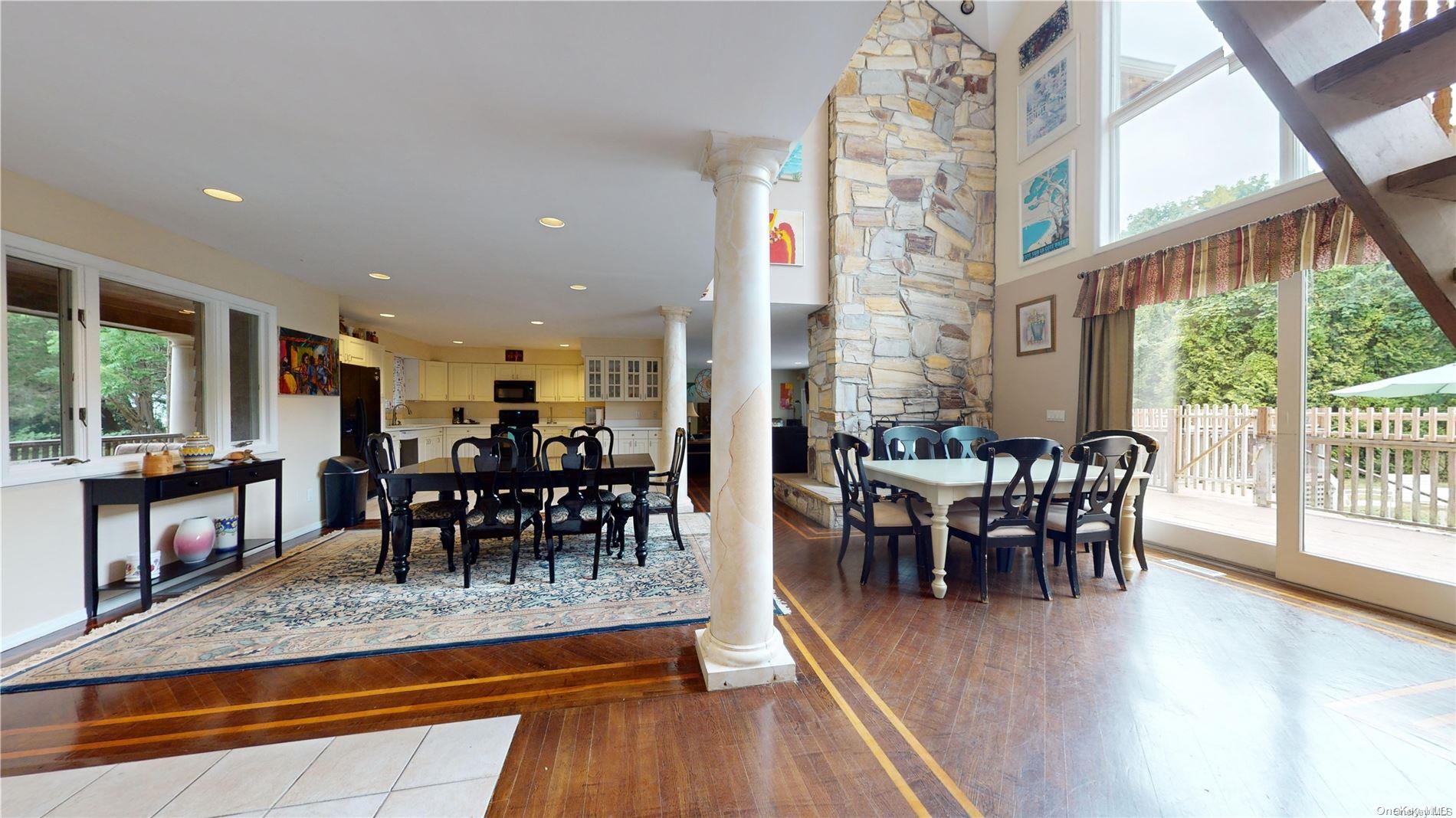 28 Club Lane Remsenburg, NY 11960 - Photo 9 of 33 a view of a dining room with furniture window and wooden floor