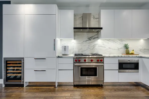 a kitchen with stainless steel appliances a stove and a refrigerator