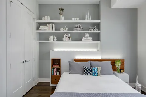 a bedroom with a bed and window