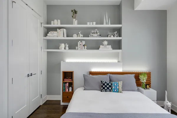 a bedroom with a bed and window