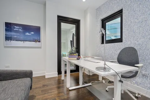 a view of a workspace with furniture