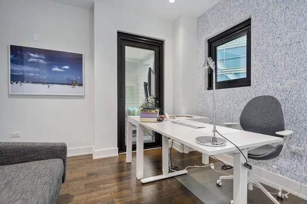 a view of a workspace with furniture