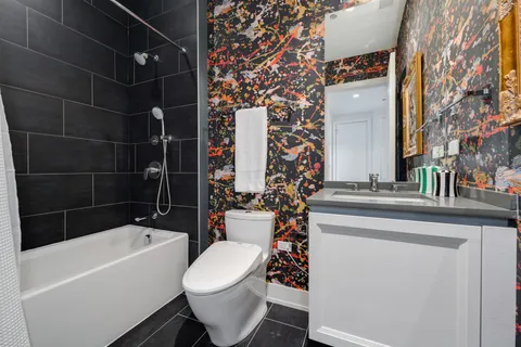 a bathroom with a toilet and a sink