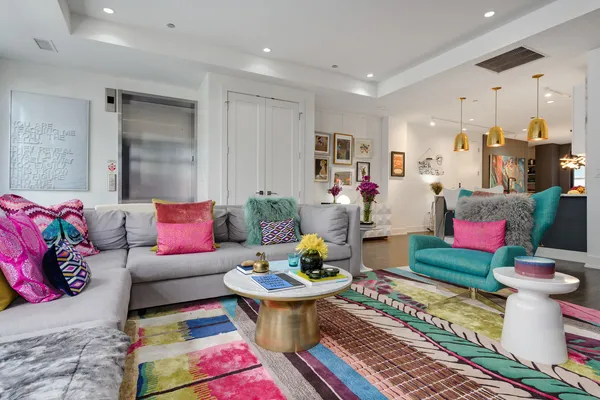 a living room with furniture and a rug