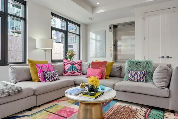 a living room with furniture and a large window