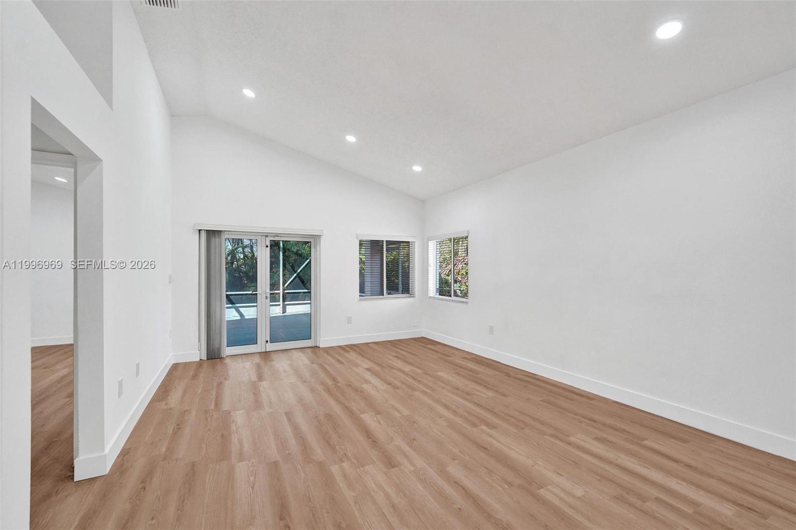 10153 Northwest 3rd Court Plantation, FL 33324 - Photo 31 of 82 a view of livingroom with window and wooden floor