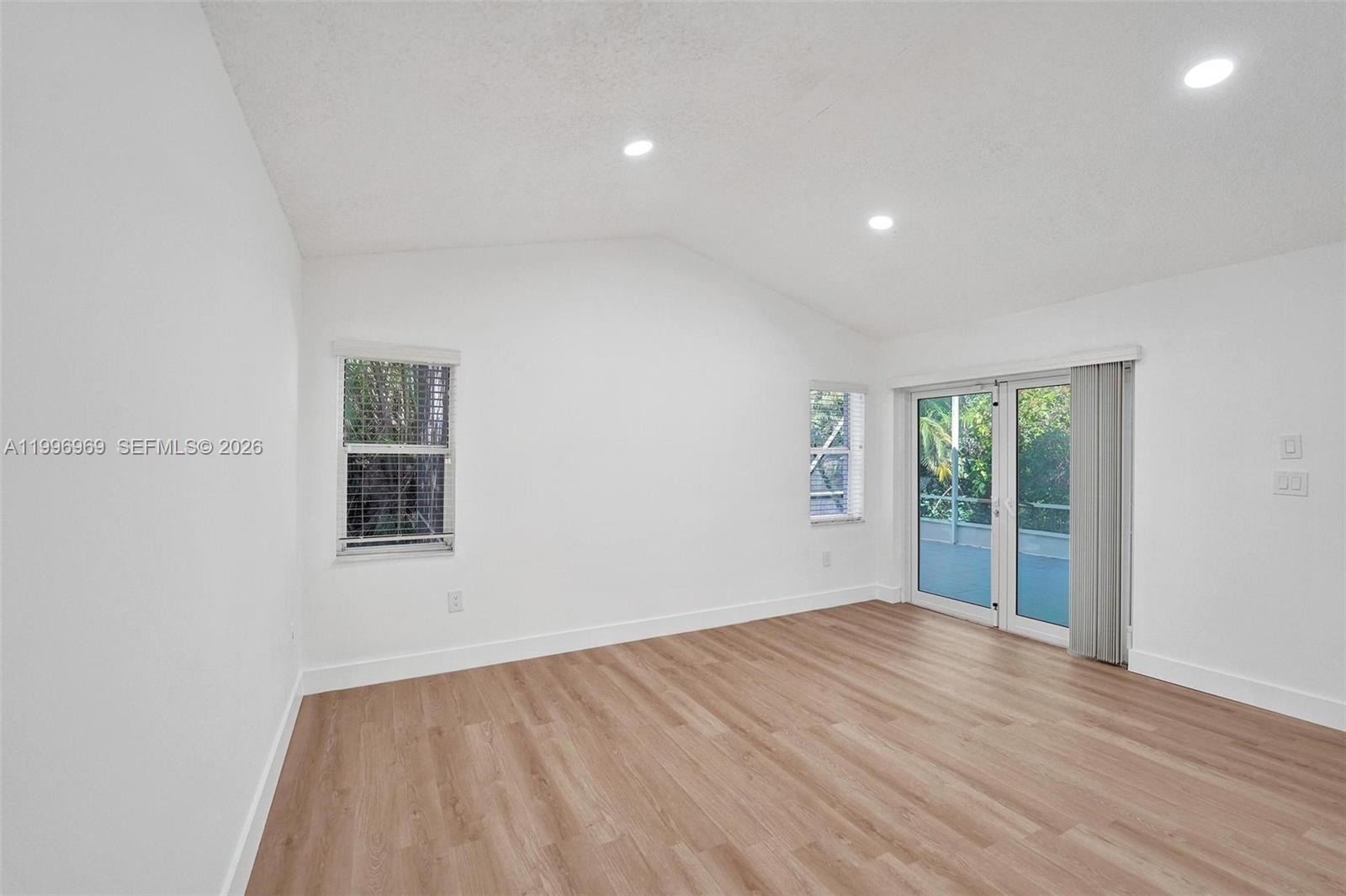 10153 Northwest 3rd Court Plantation, FL 33324 - Photo 41 of 82 wooden floor in an empty room with a window