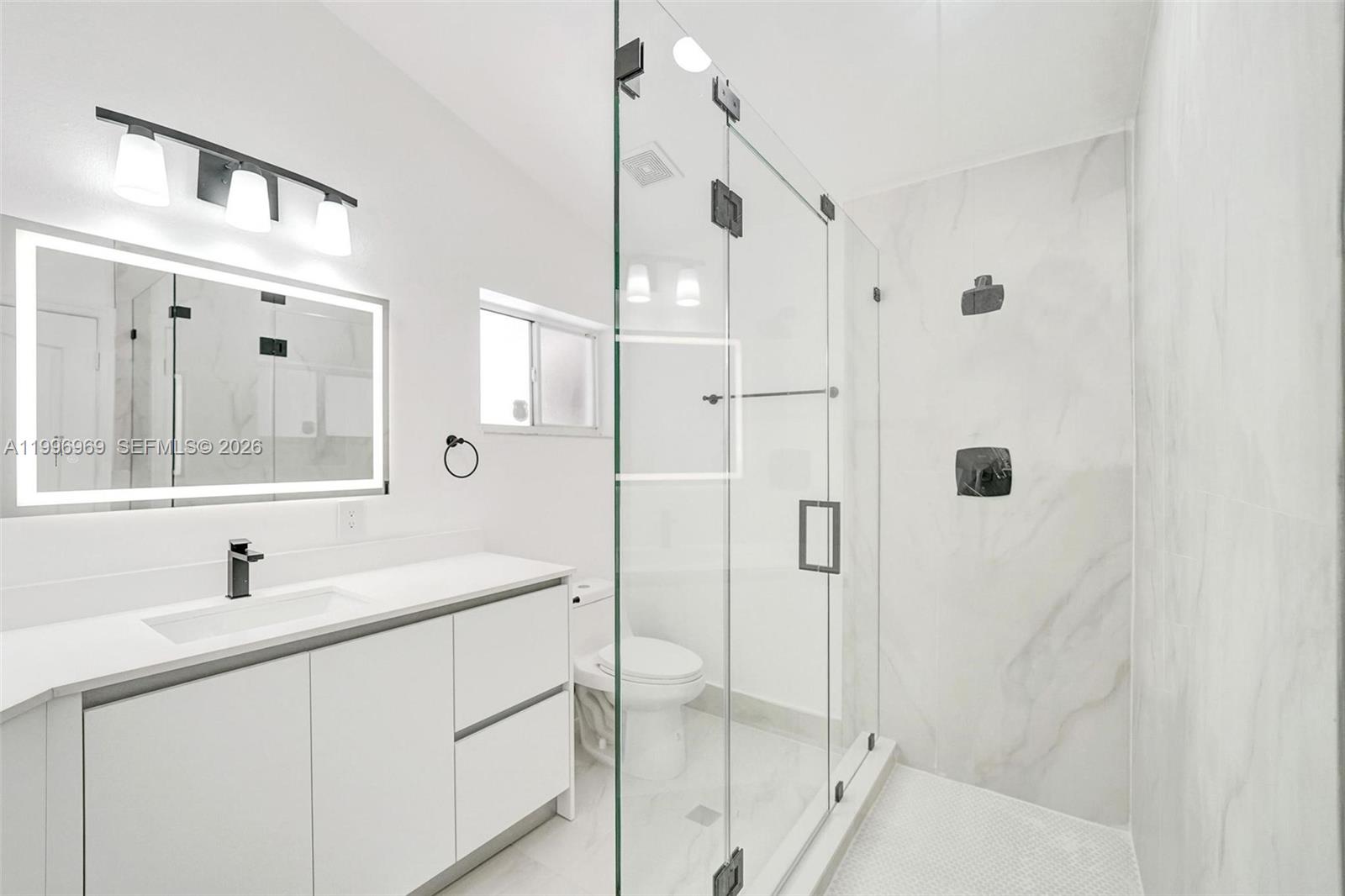 10153 Northwest 3rd Court Plantation, FL 33324 - Photo 49 of 82 a bathroom with a double vanity sink mirror and double