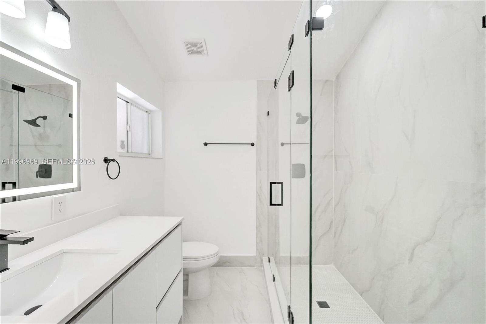 10153 Northwest 3rd Court Plantation, FL 33324 - Photo 50 of 82 a bathroom with a sink a toilet and shower