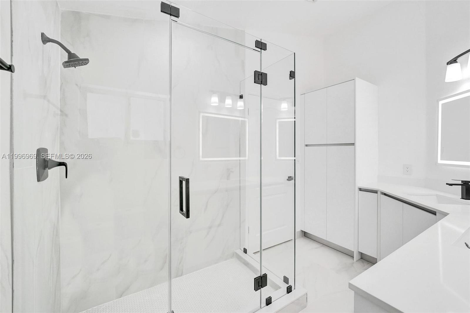 10153 Northwest 3rd Court Plantation, FL 33324 - Photo 52 of 82 a bathroom with a shower and a glass door
