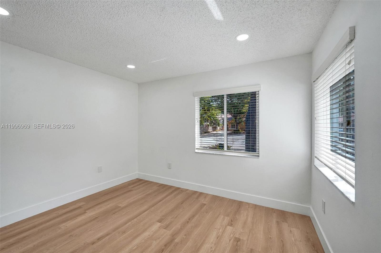 10153 Northwest 3rd Court Plantation, FL 33324 - Photo 67 of 82 wooden floor in an empty room with a window