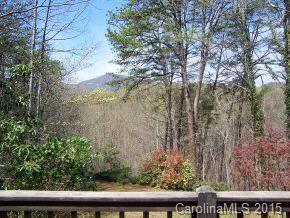 69 Eargle Road Tryon, NC 28782 - Photo 2 of 4 a view of backyard with green space and wooden fence