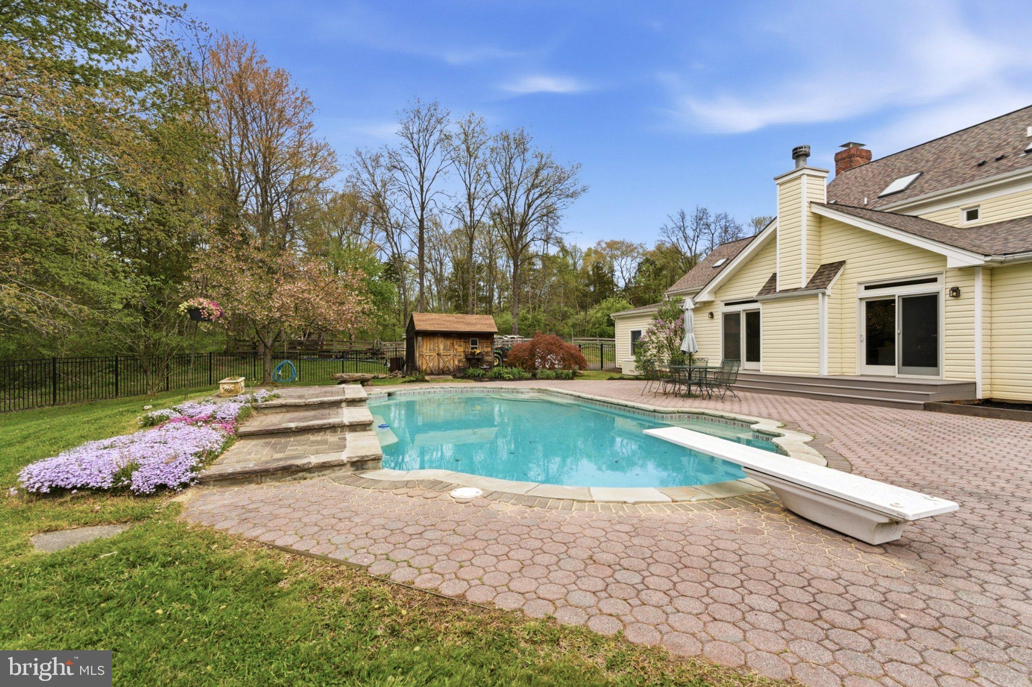 112 Stony Brook Road Hopewell, NJ 08525 - Photo 37 of 69 A in-ground pool with a waterfall