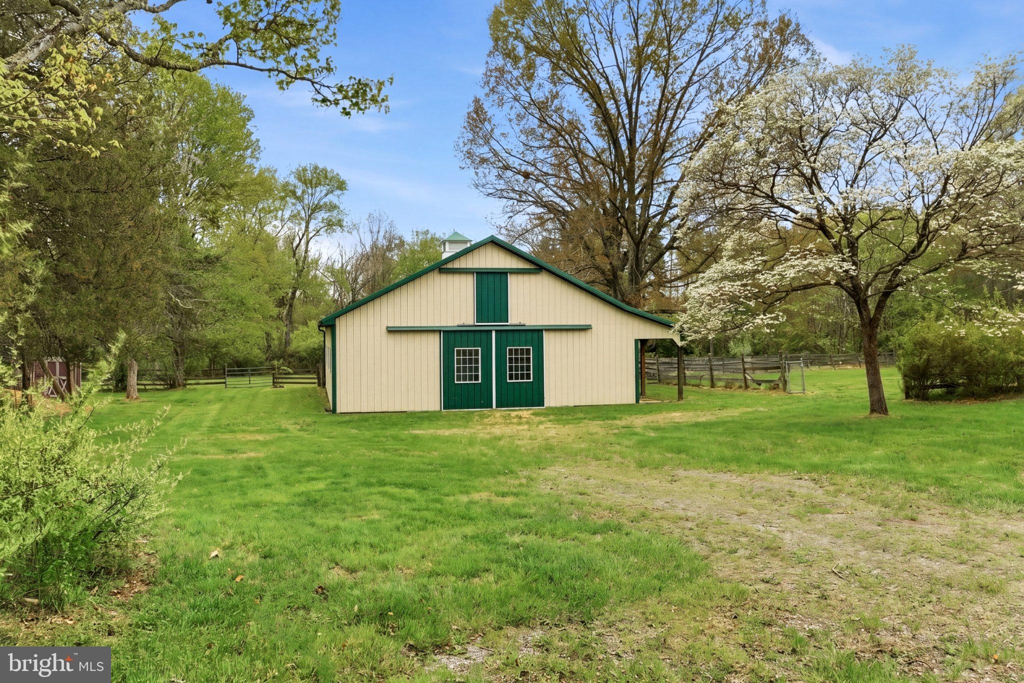 112 Stony Brook Road Hopewell, NJ 08525 - Photo 49 of 69 Charming 7 stall barn amidst lush greenery.