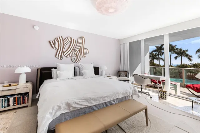 a bedroom with a bed and dresser