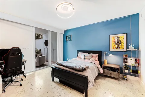 a bedroom with a bed and cabinets