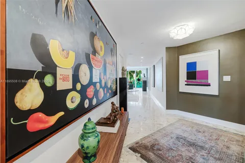 a view of a room with painting and a rug