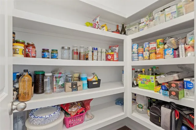a cabinet with a book shelf and a shelf