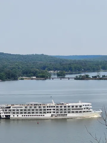a view of a lake with houses in the back