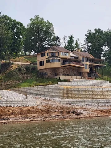 a view of a swimming pool with a yard