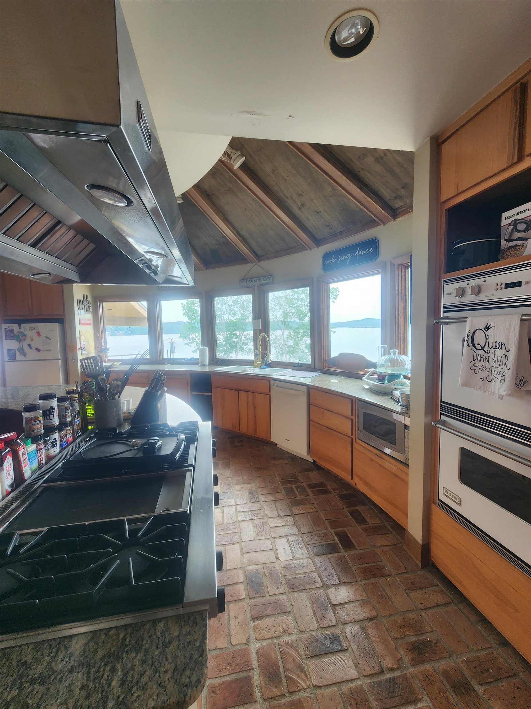 200 Eagle View Drive Cherokee, AL 35616 - Photo 5 of 34 a kitchen with stainless steel appliances kitchen island granite countertop a stove a sink and a microwave
