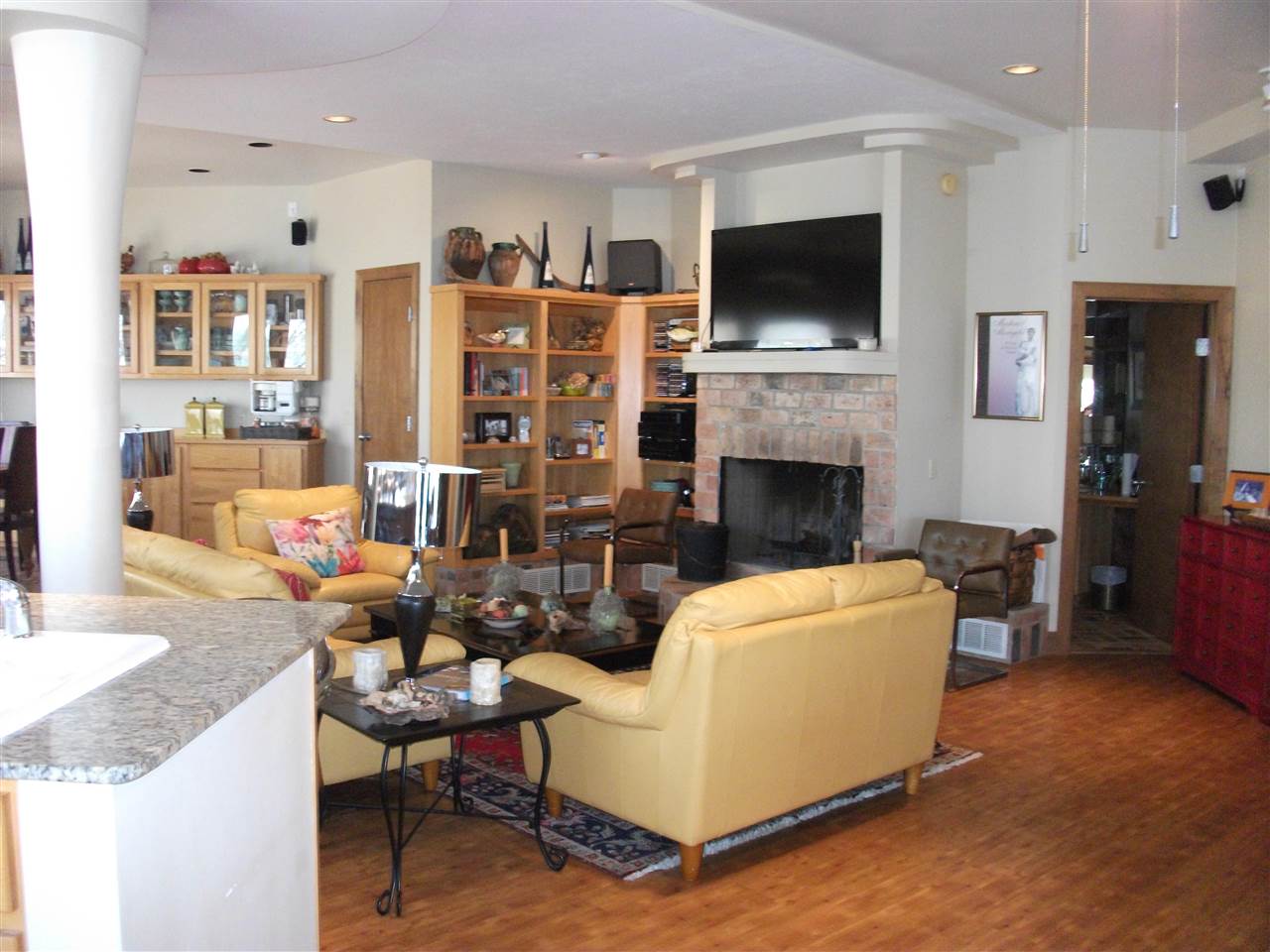 200 Eagle View Drive Cherokee, AL 35616 - Photo 6 of 34 a living room with furniture a flat screen tv and a fireplace